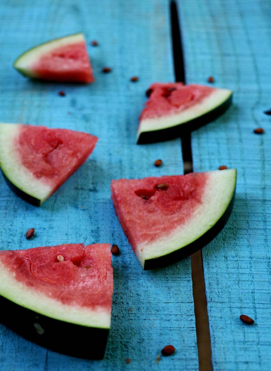 Watermelon slices on blue boards