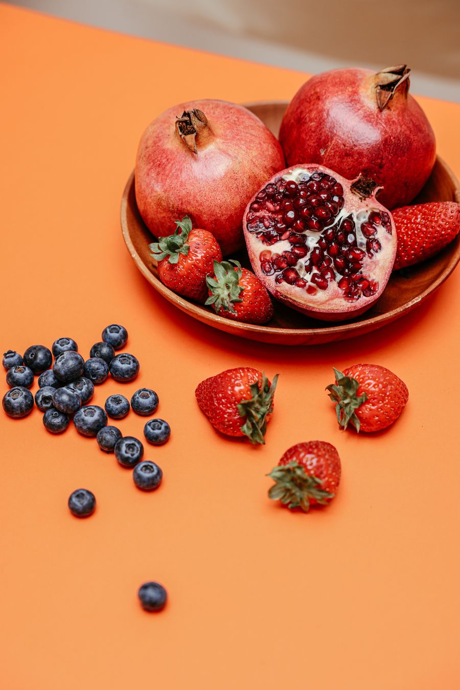 Pomegranate, strawberries, and blueberries